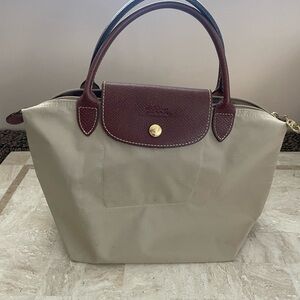 Longchamp Le Pliage top handle travel bag.